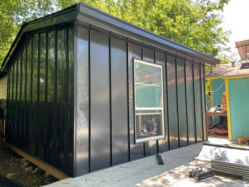 Black standing seam metal wall panels for Roof Inspection in Raytown